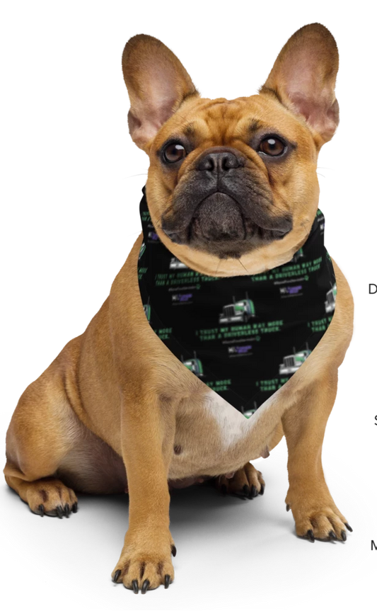 dog wearing a black bandana with green truck repeating pattern and text.